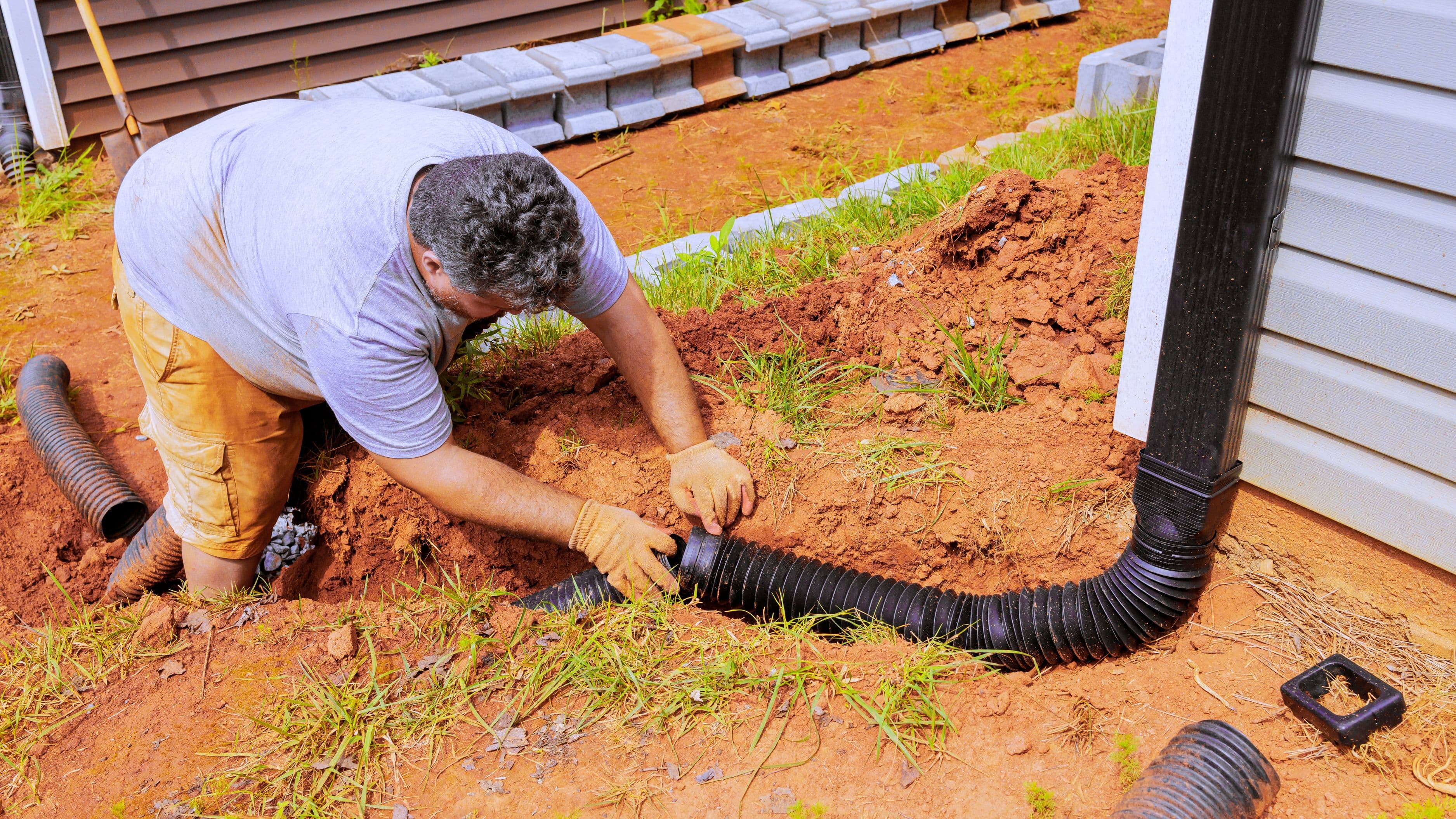 How to Reattach a Rain Gutter Downspout That Has Pulled Free